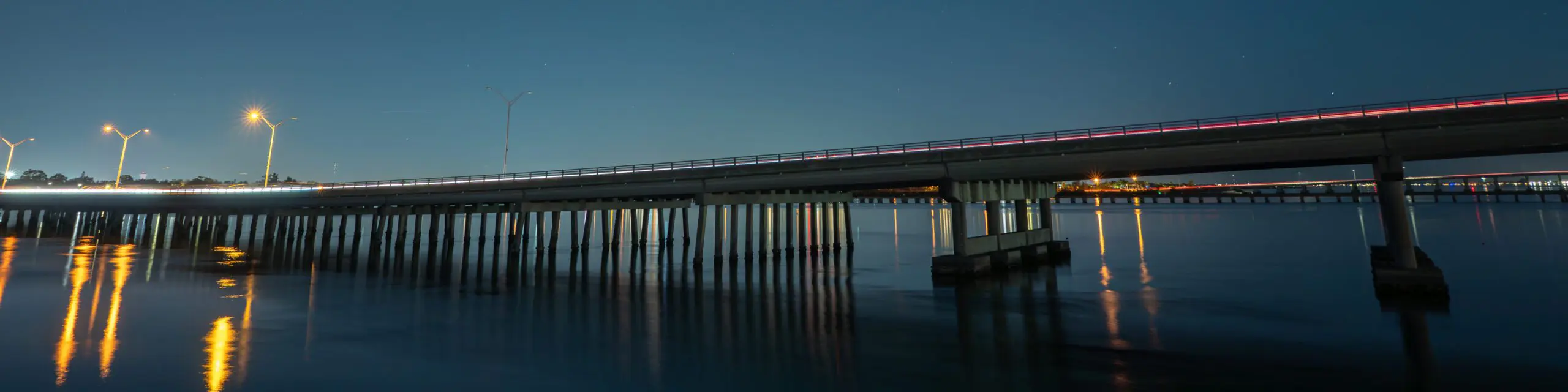 Bridge with light trails at night